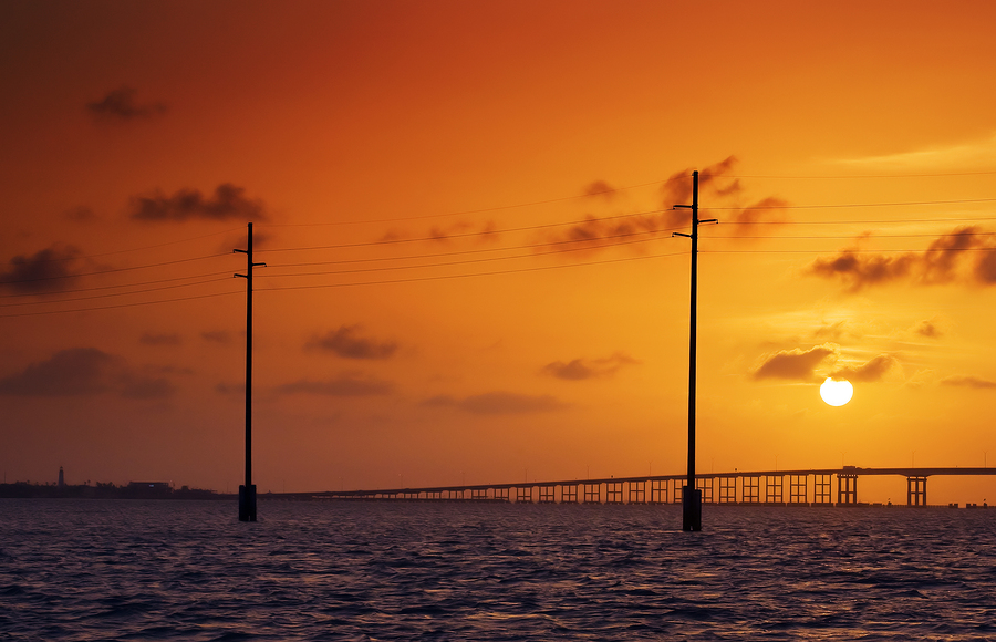 Sunset view  on South Padre Island bridge and poles